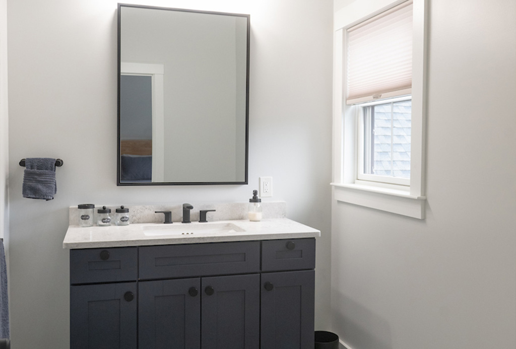 Guest bathroom vanity with stone countertop in Dover NH