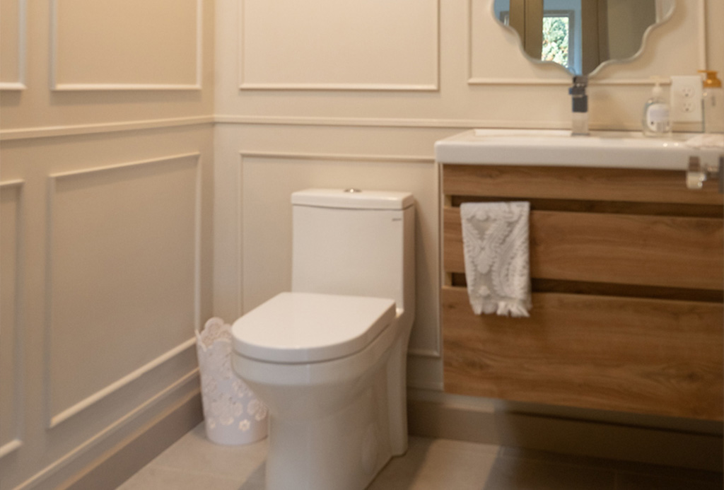 Detailed powder room with paneled walls in Goffstown NH