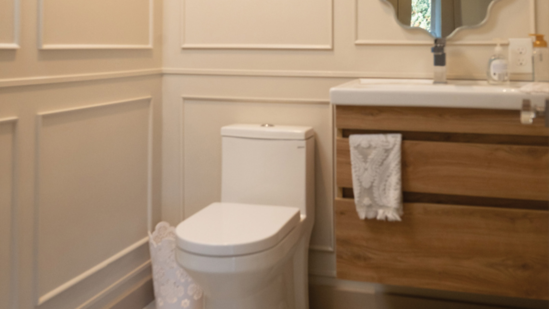 Detailed powder room with paneled walls in Goffstown NH