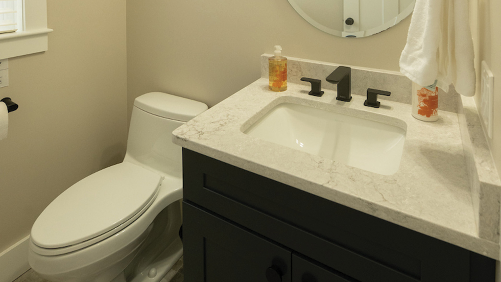 Custom powder room vanity and lighting by Serenity Baths in Dover NH