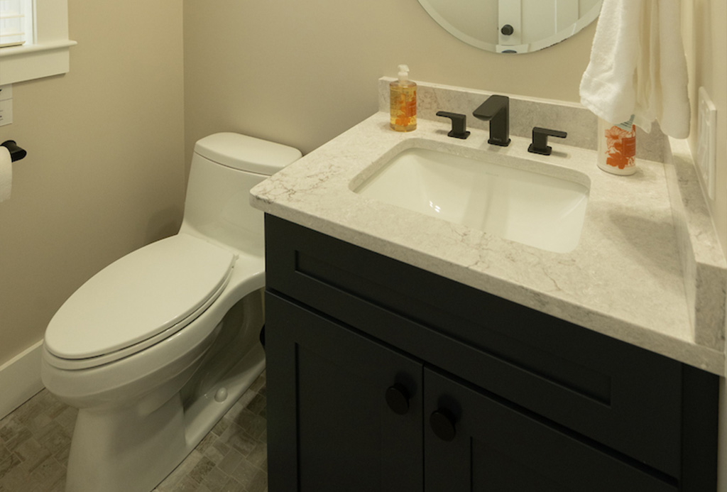Custom powder room vanity and lighting by Serenity Baths in Dover NH